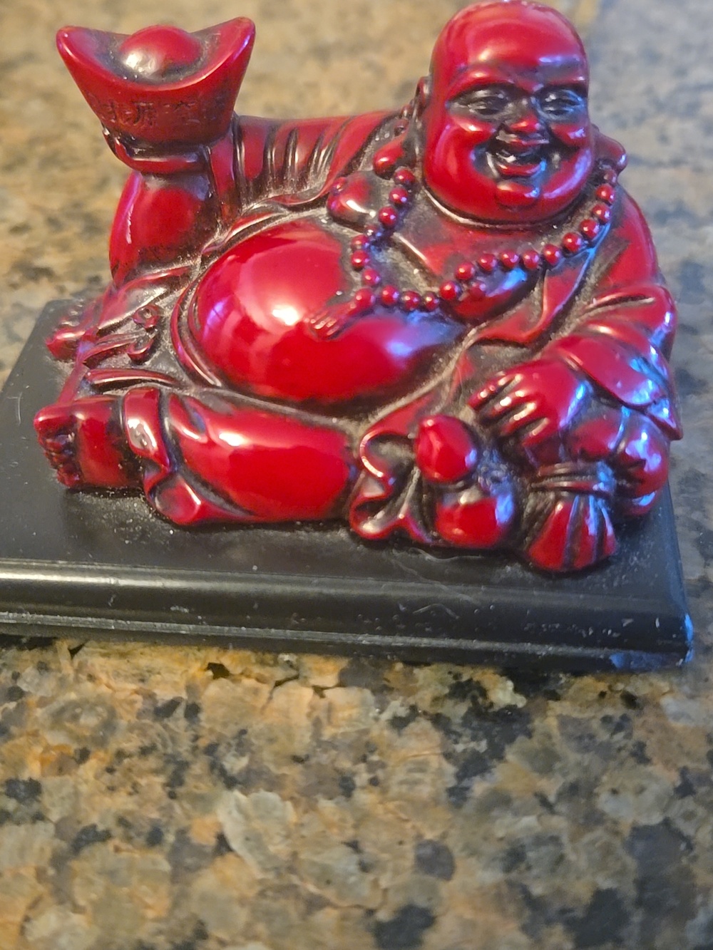 Small little Buddha red and black resin and wood like new condition